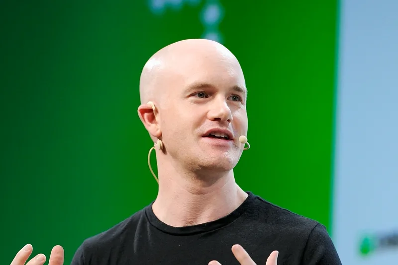 Brian Armstrong speaking at a tech conference